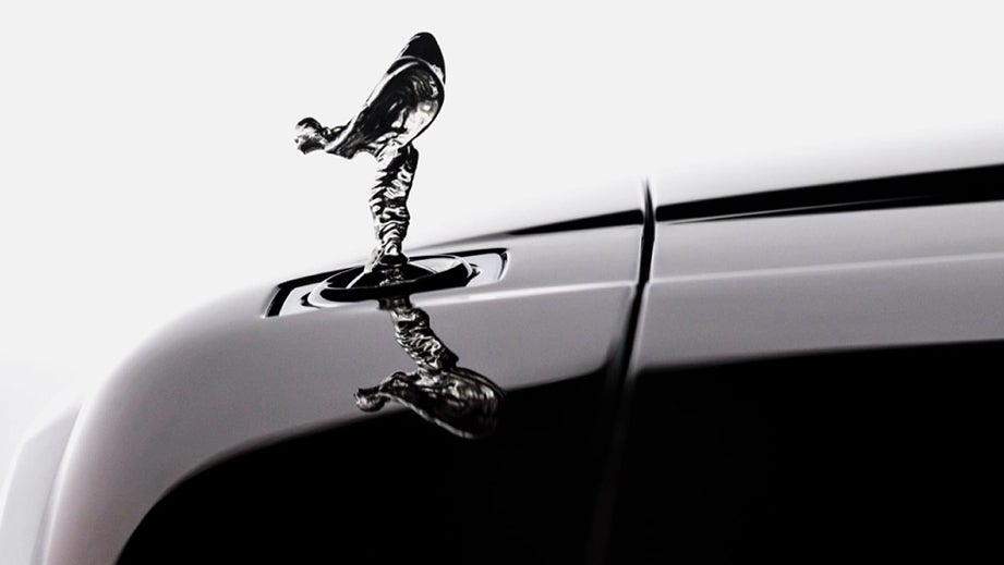 close-up of hood ornament on a Rolls-Royce Cullinan