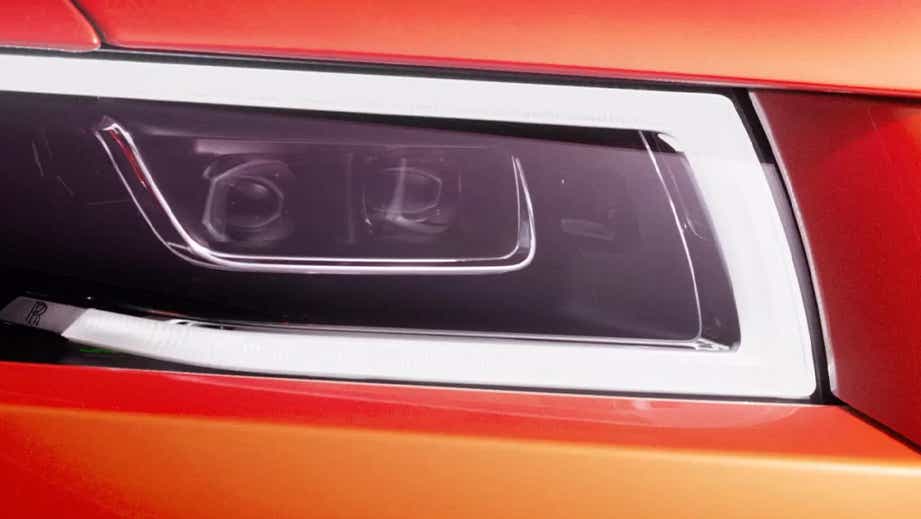 Headlight close-up of a Rolls-Royce Ghost