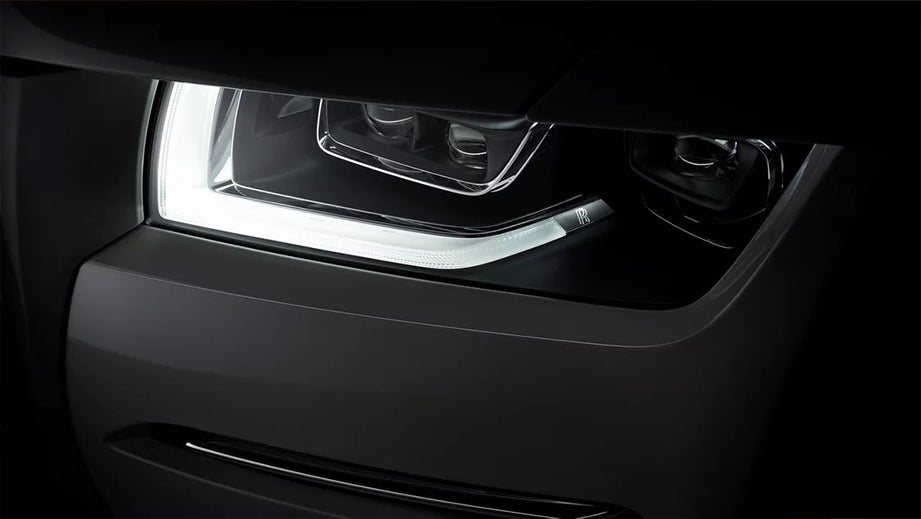 headlight close-up of a Rolls-Royce Ghost