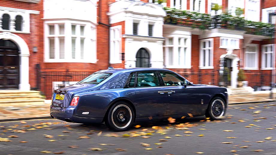 rear three-quarter view of a Rolls-Royce Phantom on a city street