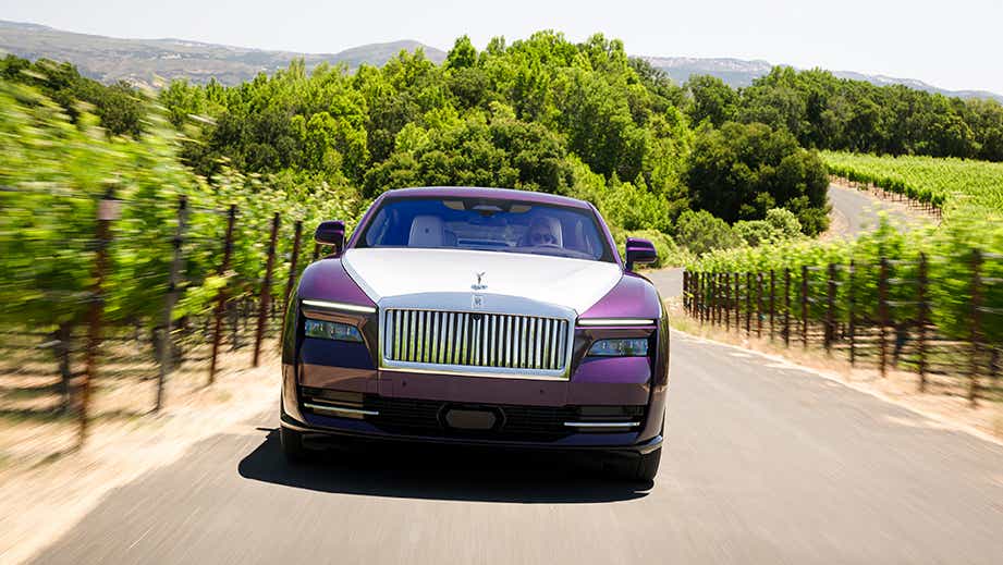 front view of a Rolls-Royce Spectre on a country road
