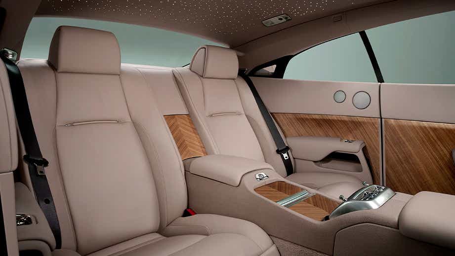 rear seat interior of a Midnight Sapphire Rolls-Royce Wraith