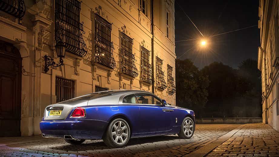 rear three-quarter view of a Midnight Sapphire Rolls-Royce Wraith