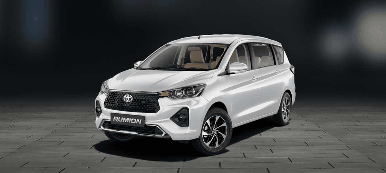 Front three-quarter view of a Cafe White Toyota Rumion