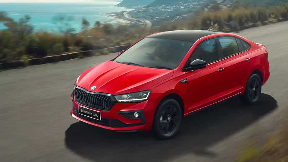 front three-quarter view of a Tornado Red Skoda Slavia Monte Carlo