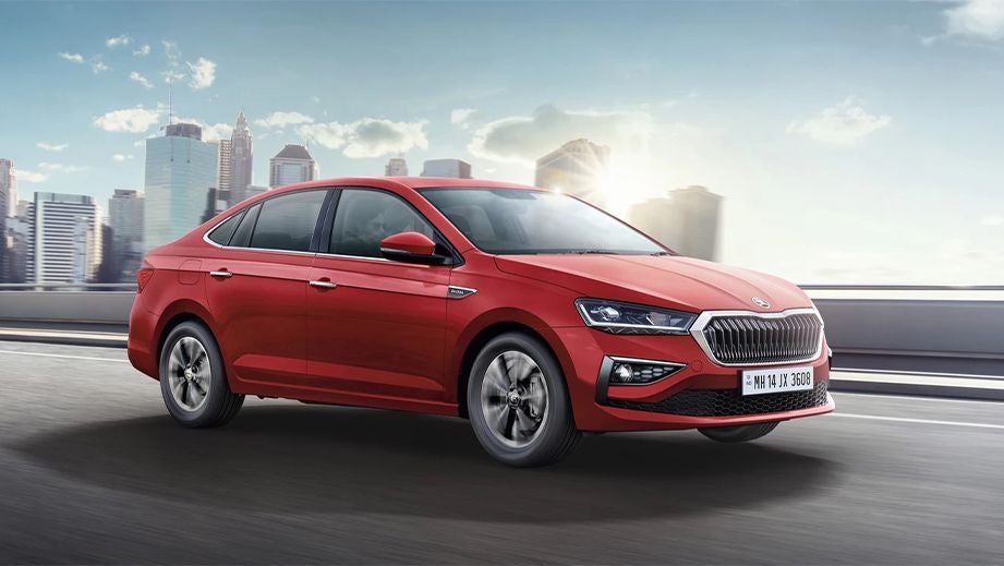 front three-quarter view of a Tornado Red Skoda Slavia