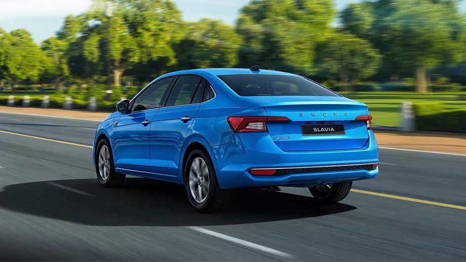 rear three-quarter of a Crystal Blue Skoda Slavia