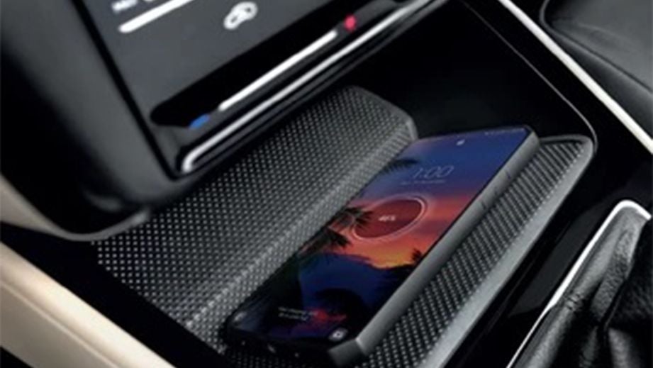 Wireless charging pad and phone in a Skoda Slavia interior