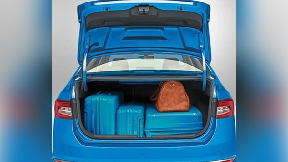 open boot space of a Skoda Slavia loaded with luggage
