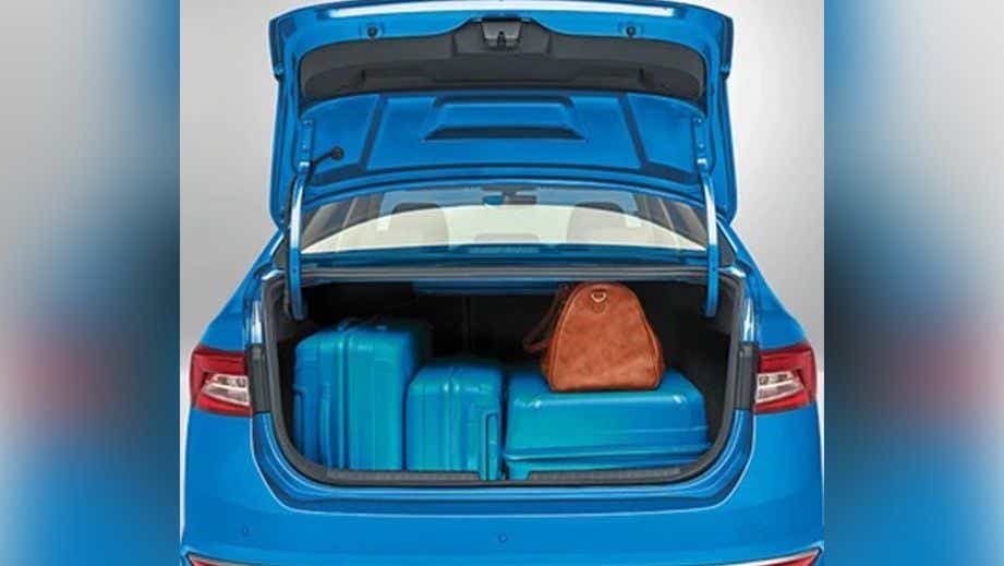 open boot space of a Skoda Slavia loaded with luggage