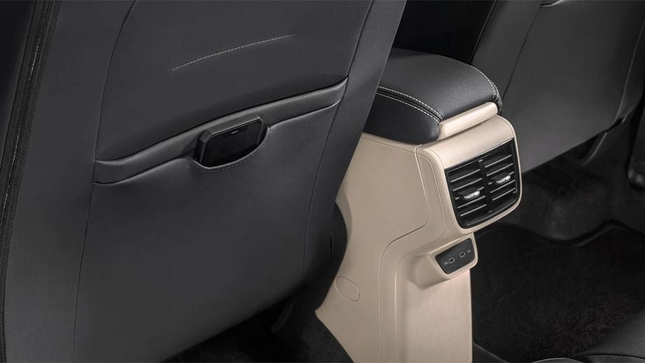 Rear seat armrest and AC vents of a Skoda Slavia