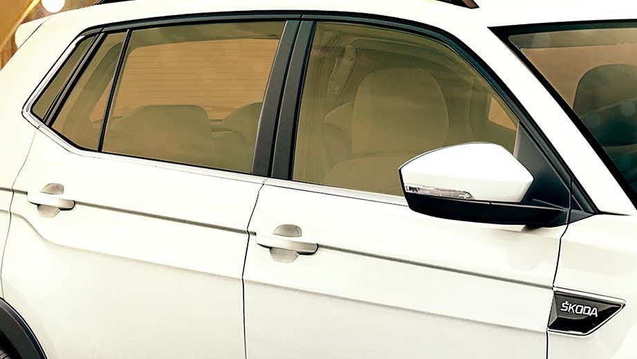 Side door and mirror view of a Skoda Kushaq