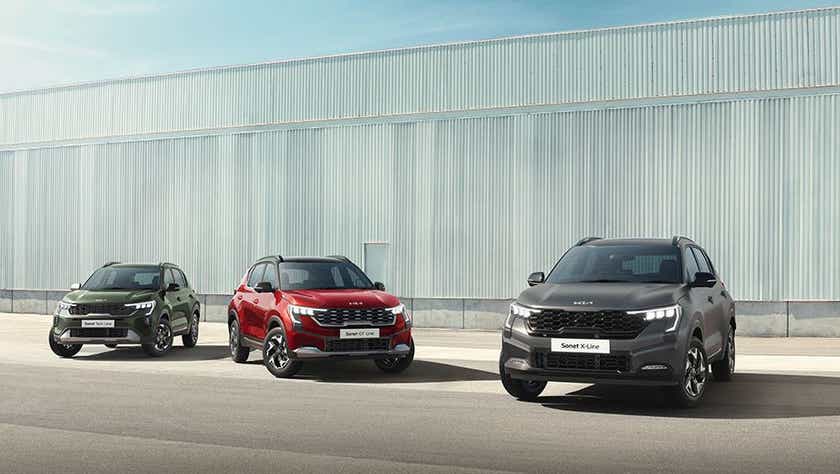 Front view of three Kia Sonet cars parked side by side