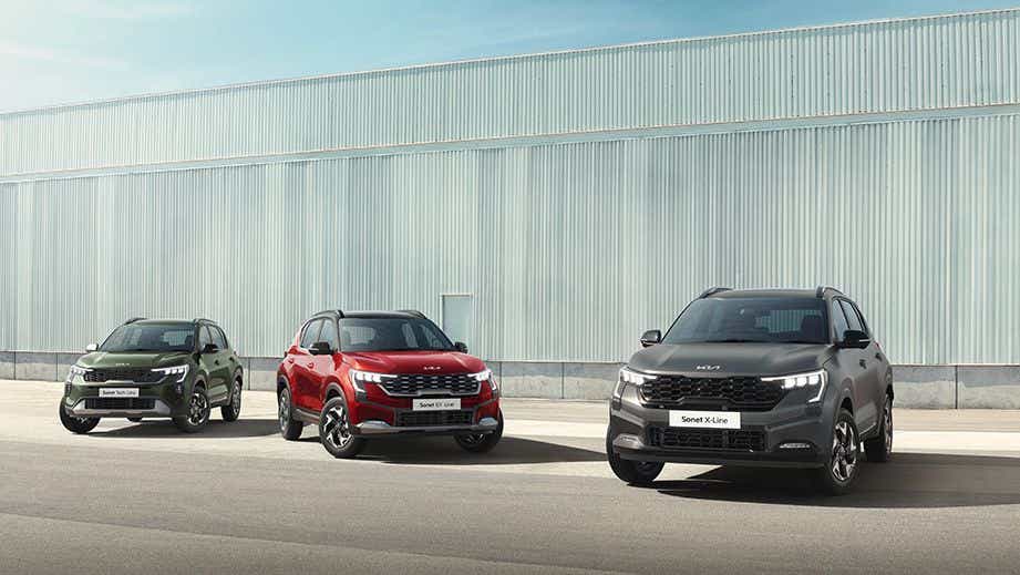 Front view of three Kia Sonet cars parked side by side