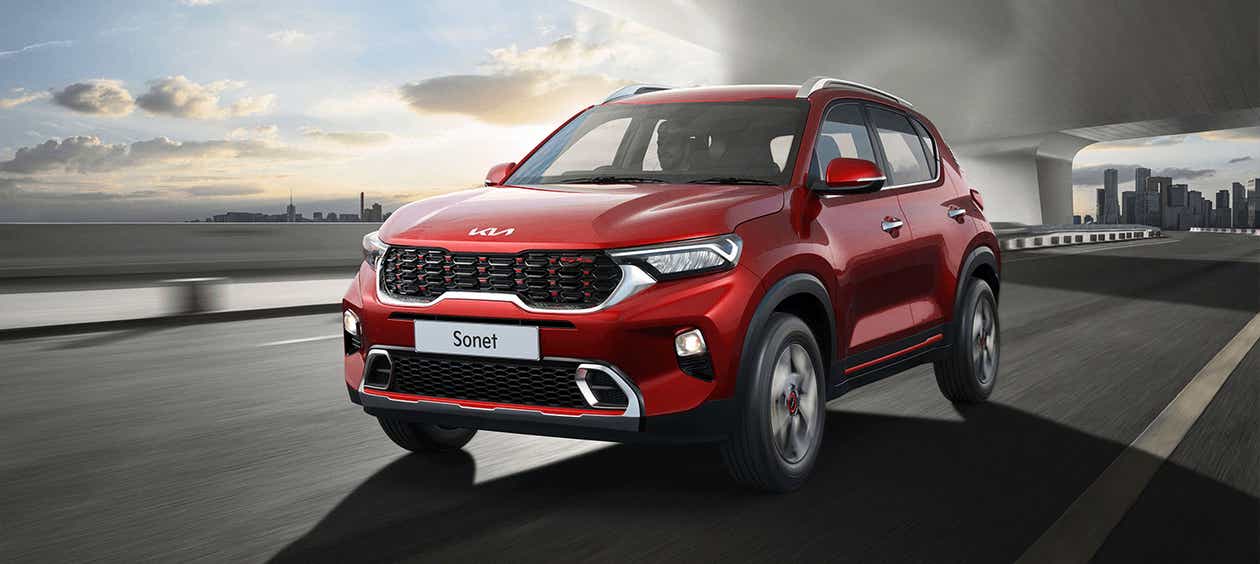 front three-quarter view of a Intense Red Kia Sonet 2020-2023