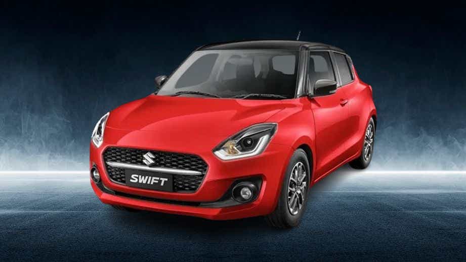 front three-quarter view of a Solid Fire Red with Pearl midnight black roof Maruti Suzuki Swift 2021 - 2023