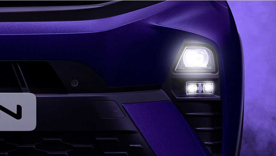 headlight close-up of a Royal Blue Tata Nexon