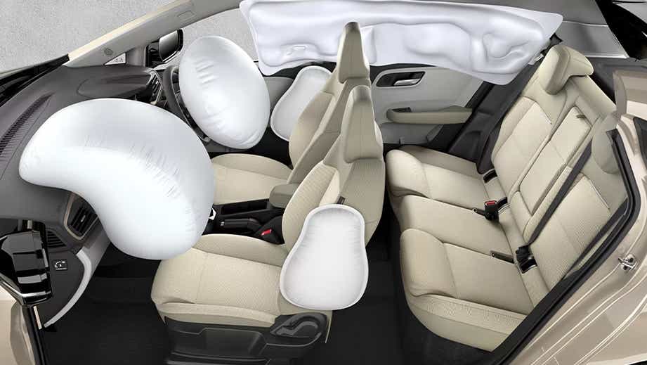 interior dashboard and seats with deployed airbags of a Tata Altroz