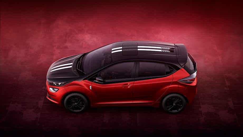 top and side view of a Atomic Orange Dual Tone Tata Altroz Racer