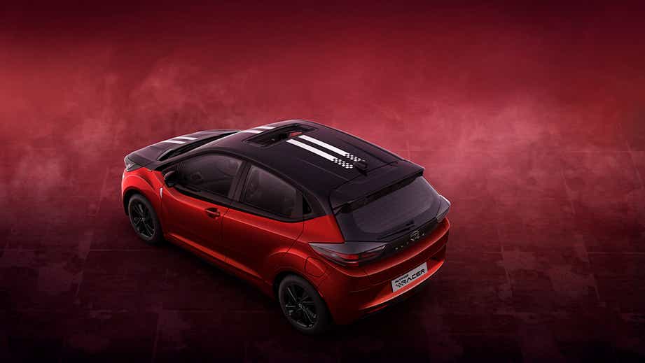 rear three-quarter of a Atomic Orange Dual Tone Tata Altroz Racer