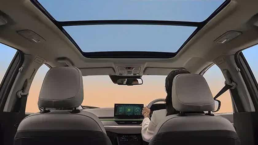 Interior dashboard and sunroof view of a Tata Curvv EV