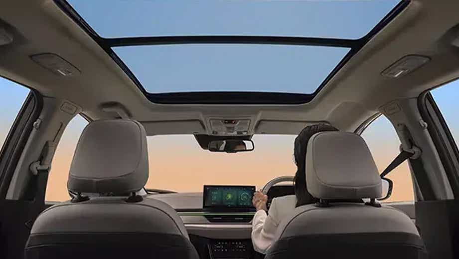 Interior dashboard and sunroof view of a Tata Curvv EV