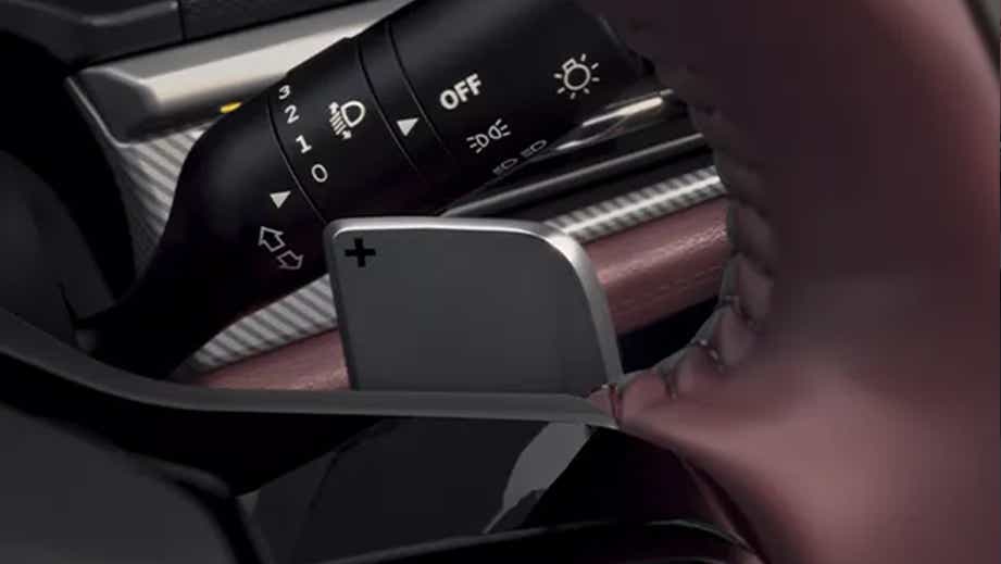 Steering wheel paddle shifter close-up of a Tata Curvv