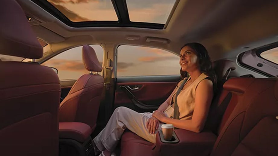 interior rear seat and sunroof view of a Tata Curvv