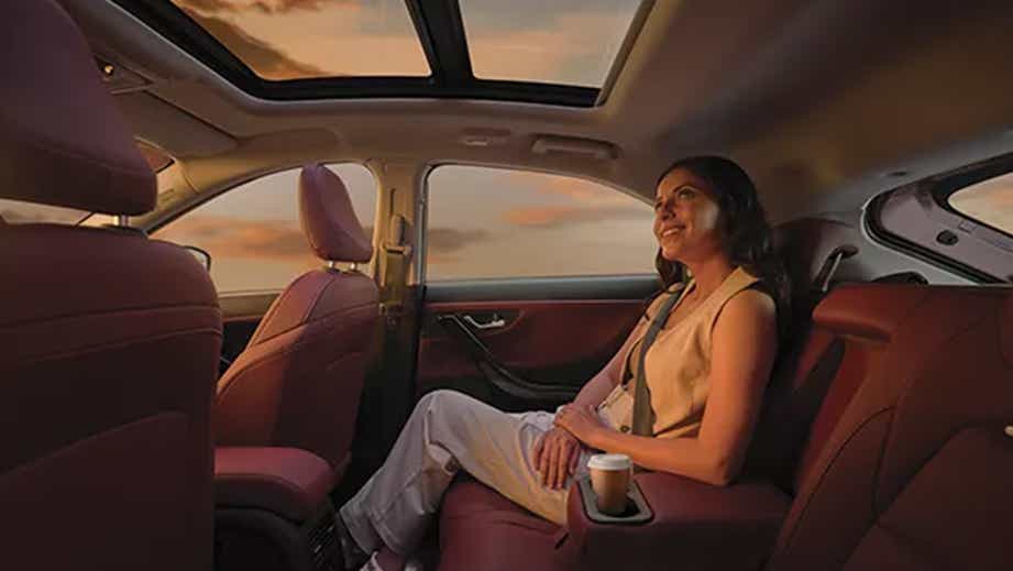 interior rear seat and sunroof view of a Tata Curvv