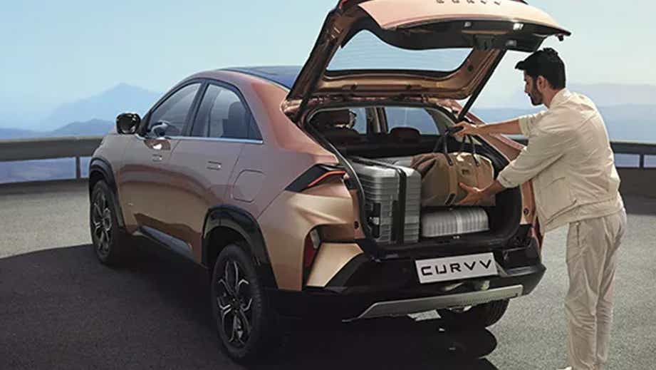 Open boot view of a Tata Curvv with luggage