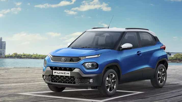 front three-quarter view of a Tornado Blue with White Roof Tata Punch