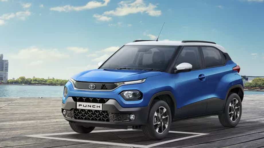 front three-quarter view of a Tornado Blue with White Roof Tata Punch