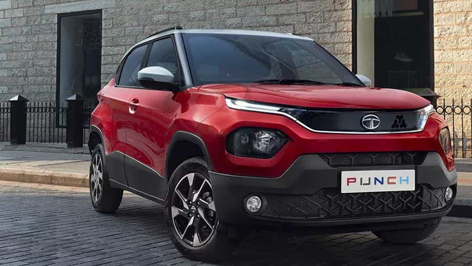 front three-quarter view of a Calypso Red with White Roof Tata Punch