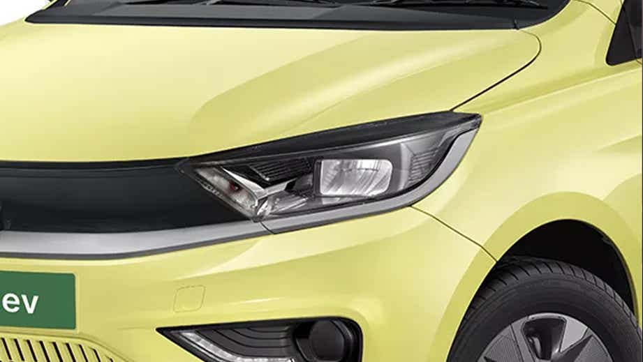 Front left headlight close-up of a Chill Lime With Dual Tone Tata Tiago EV