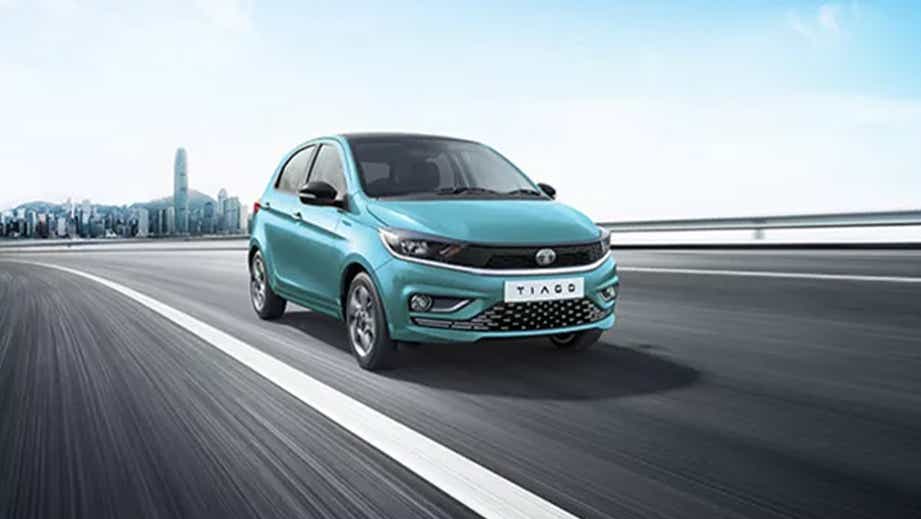 front three-quarter view of a Tata Tiago on a highway