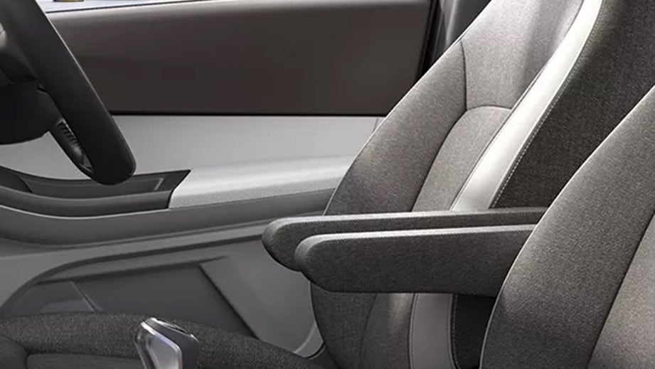 Front seat and armrest of a Tata Tigor interior