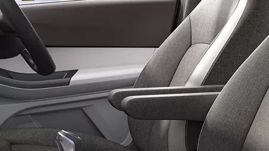 Front seat and armrest of a Tata Tigor interior