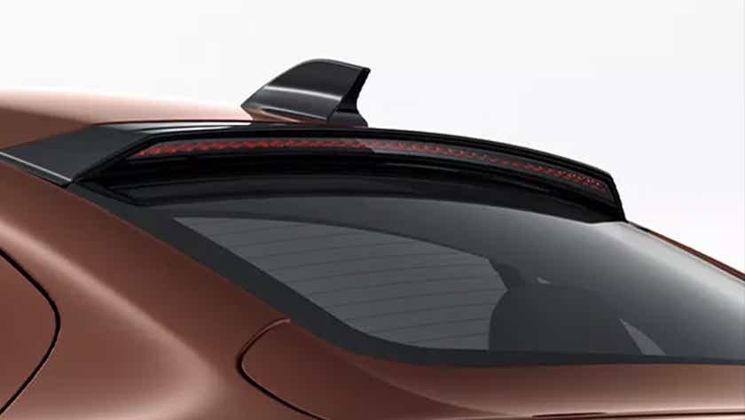 rear windshield and spoiler of a Supernova Copper Tata Tigor