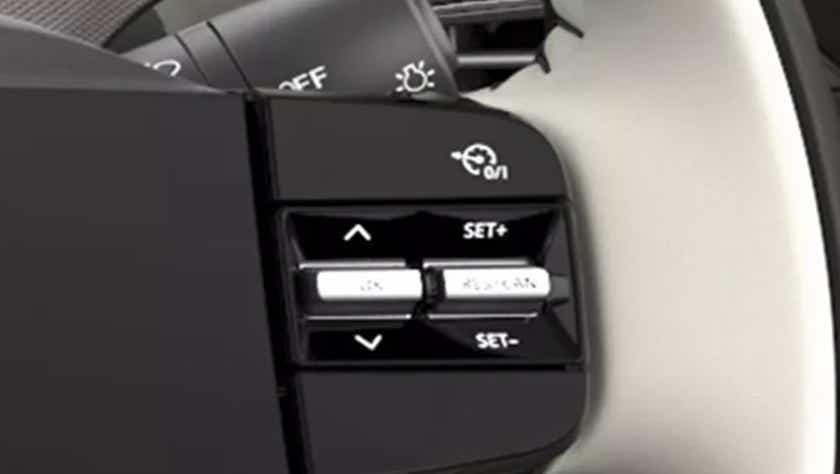 Steering wheel cruise control buttons of a Tata Tigor