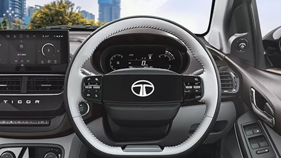 Interior dashboard and steering wheel of a Tata Tigor