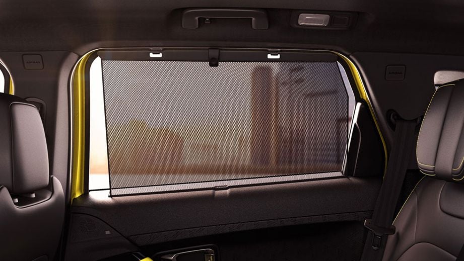 Rear-seat window sunshade view of a Tata Harrier