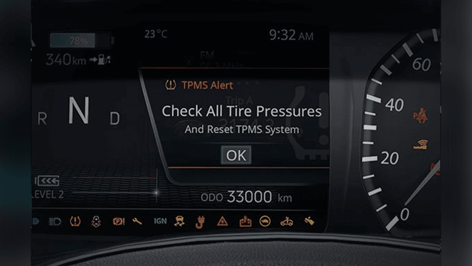 instrument cluster view of a Tata Nexon EV Prime with tire pressure alert