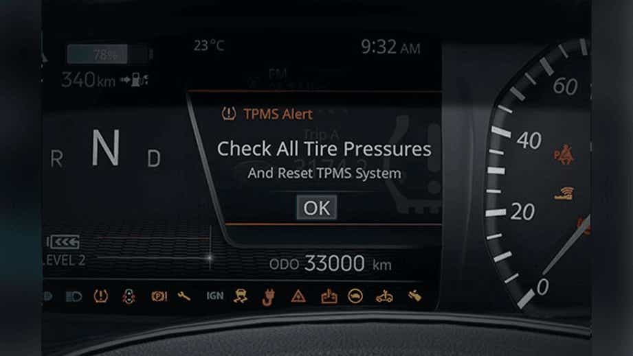 instrument cluster view of a Tata Nexon EV Prime with tire pressure alert