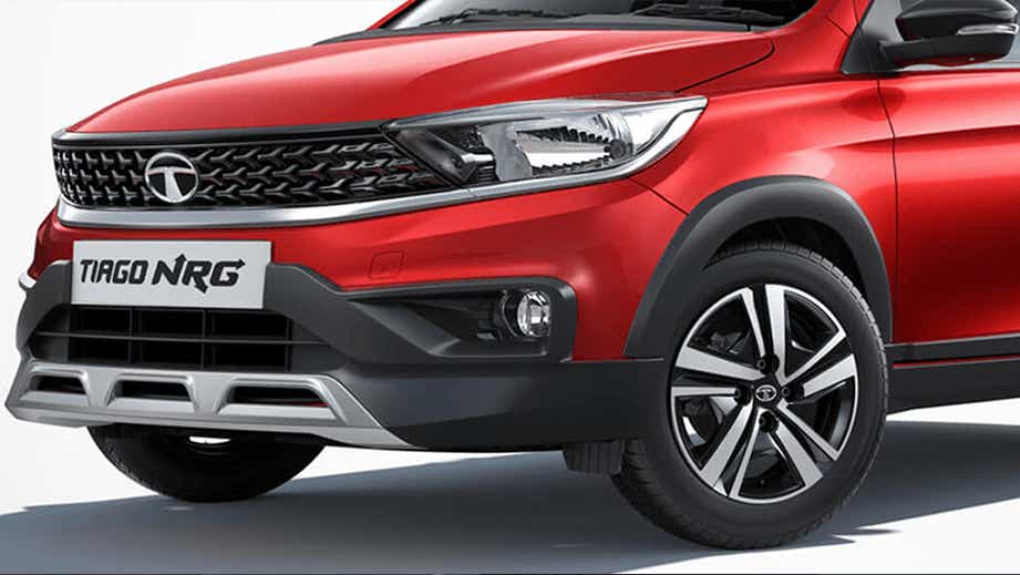 Front three-quarter view of a Fire Red Tata Tiago NRG