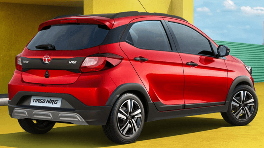 Rear three-quarter view of a Fire Red Tata Tiago NRG