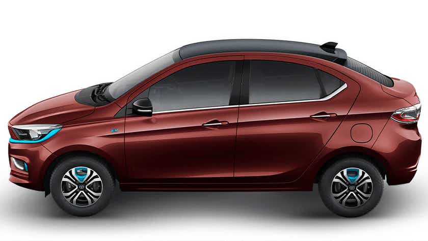 side view of a Magnetic Red Tata Tigor EV