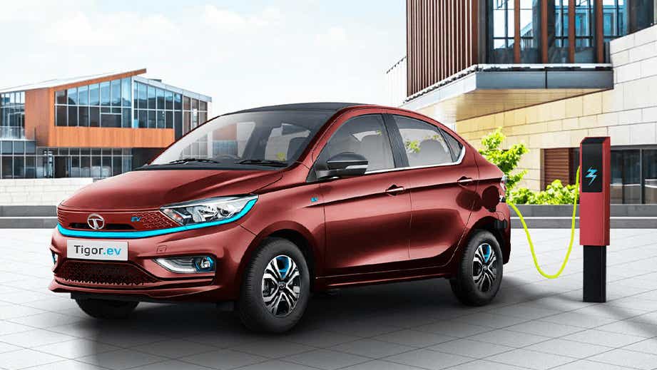 front three-quarter view of a Magnetic Red Tata Tigor EV