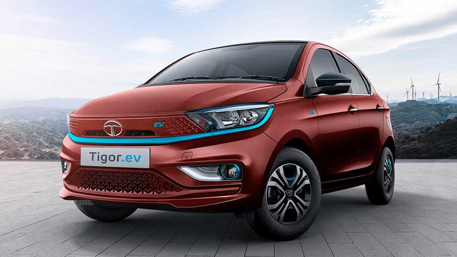 front three-quarter view of a Magnetic Red Tata Tigor EV