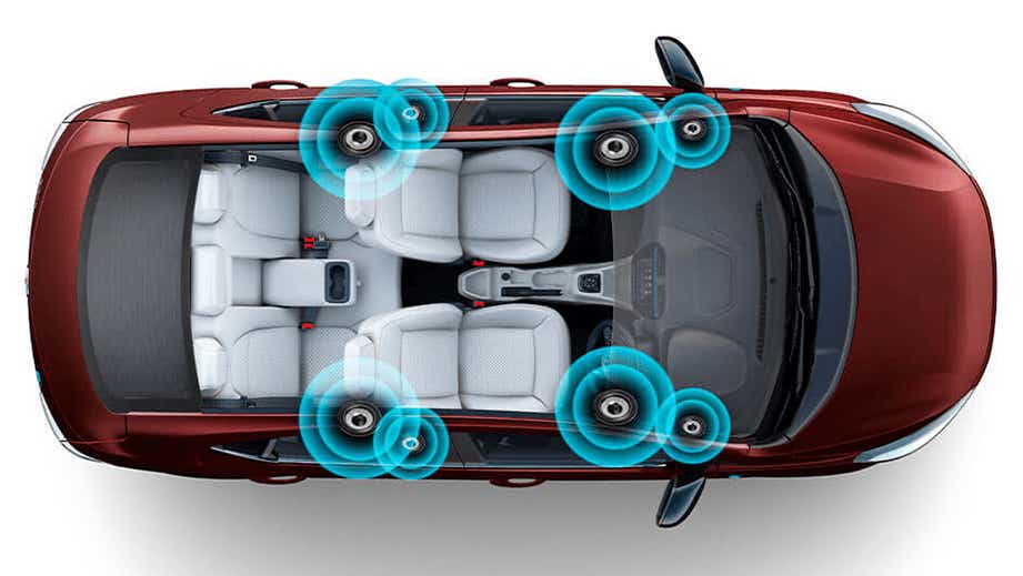 top interior view of a Tata Tigor EV highlighting speaker placement