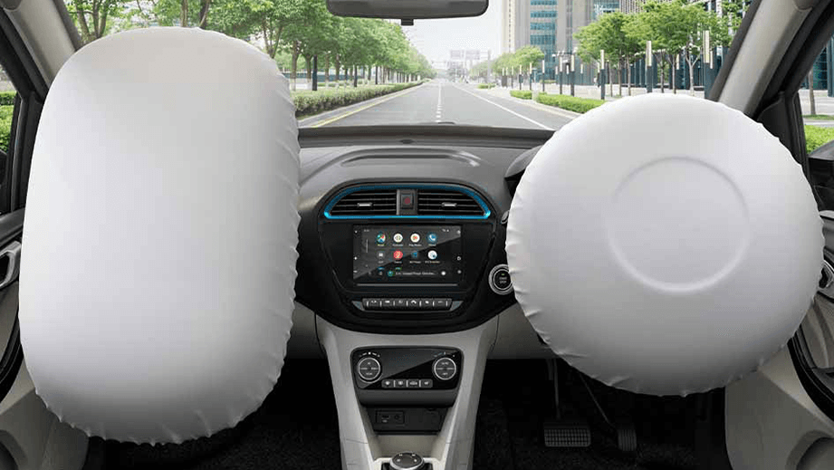 Front interior view with airbags deployed of a Tata Tigor EV